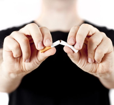 man-breaks-cigarette-462x428